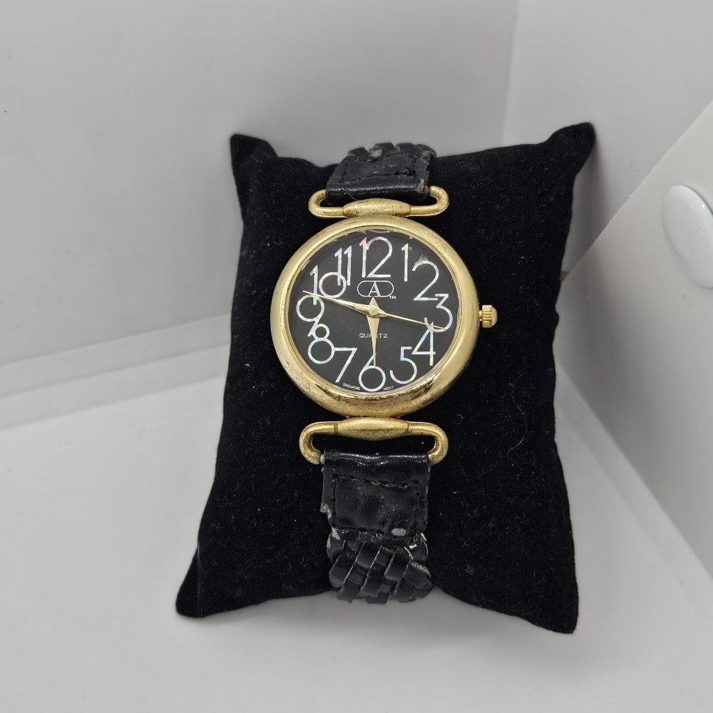 vintage Avenue by Design black and gold tone watch with iridescent digits